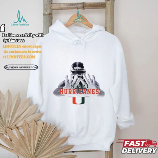 Football player garb Miami Hurricanes logo shirt