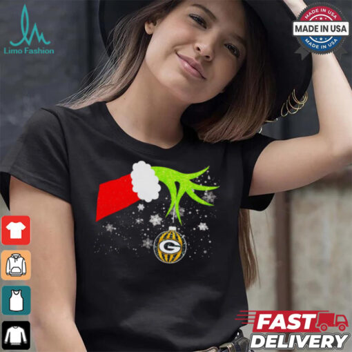 Grinch hand holding ornament Packers football Christmas shirt