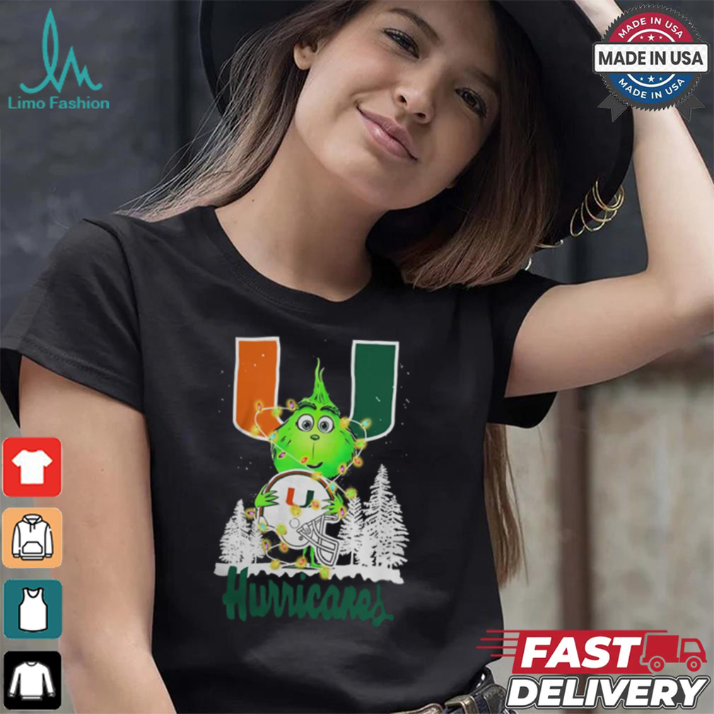 The Grinch Hug Miami Hurricanes Helmet Christmas Shirt The Grinch Hug Miami Hurricanes Helmet Christmas Shirt