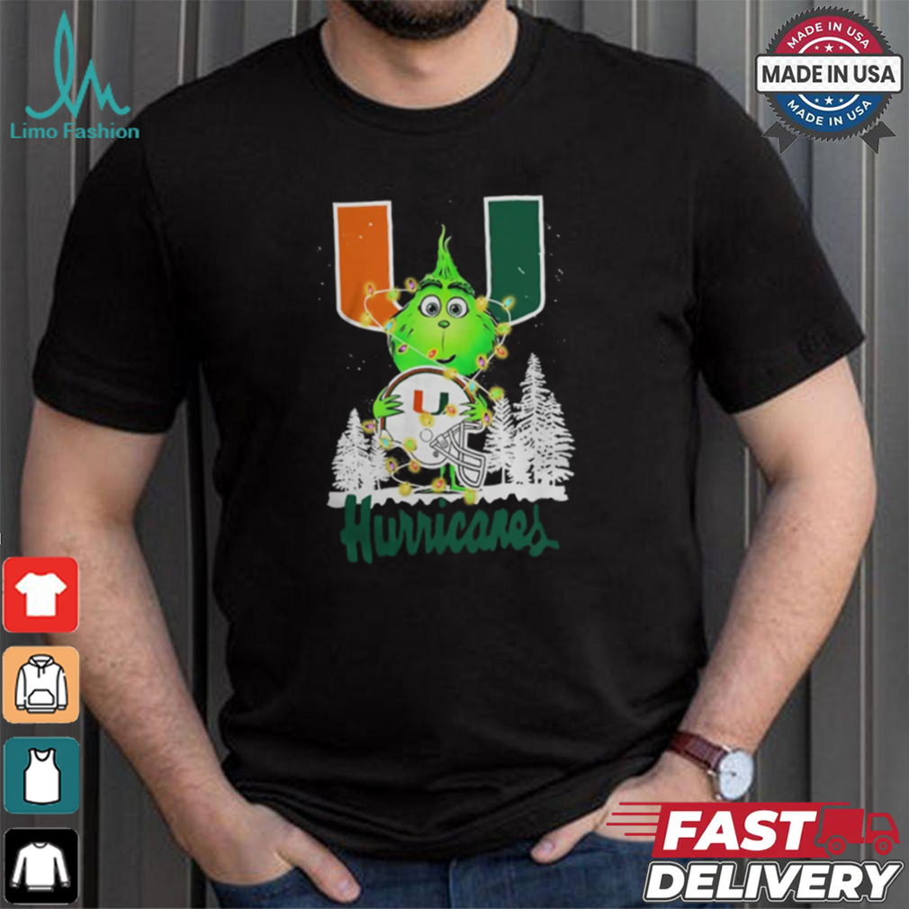 The Grinch Hug Miami Hurricanes Helmet Christmas Shirt The Grinch Hug Miami Hurricanes Helmet Christmas Shirt