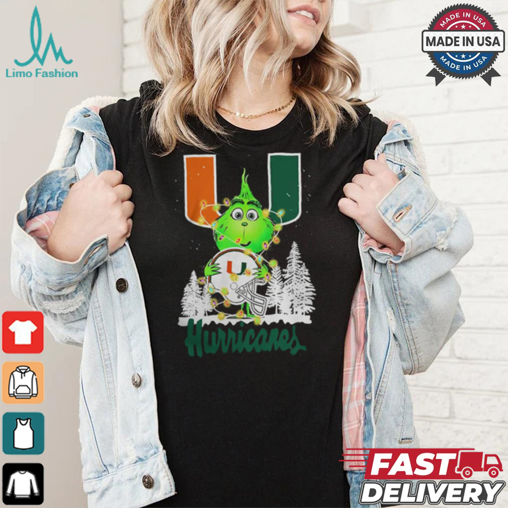 The Grinch Hug Miami Hurricanes Helmet Christmas Shirt The Grinch Hug Miami Hurricanes Helmet Christmas Shirt