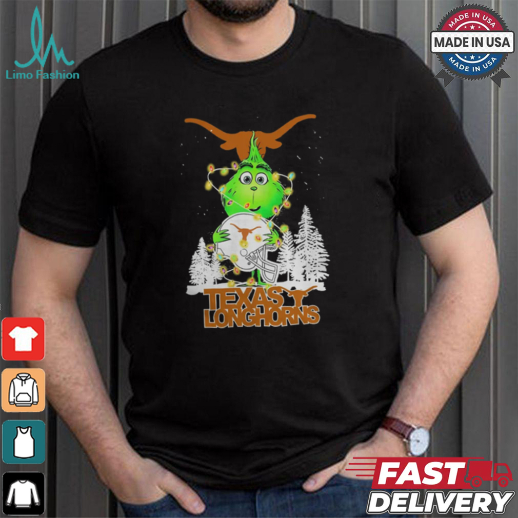 The Grinch Hug Texas Longhorns Helmet Christmas Shirt The Grinch Hug Texas Longhorns Helmet Christmas Shirt