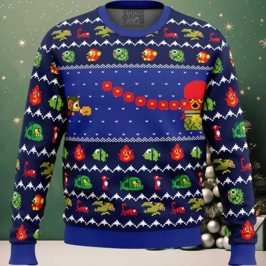 Alex Kidd In Christmas World Ugly Christmas Sweater, hoodie, sweater, long sleeve and tank top Person happily wearing Alex Kidd In Christmas World Ugly Christmas Sweater while playing a retro video game console